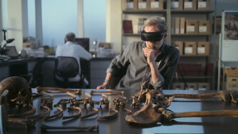 archaeologist using vr to study ancient human remains