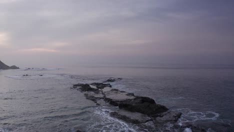 waves crashing off the coast of california