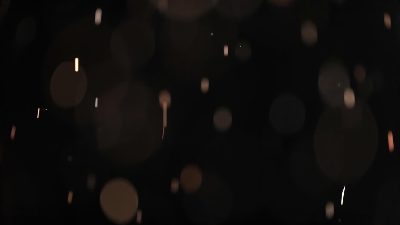 bokeh de partículas abstractas flotantes sobre fondo oscuro