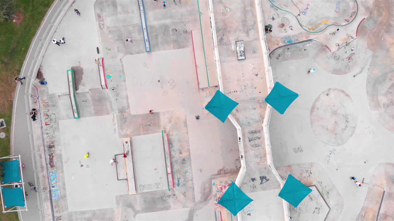 Drone footage Above Skatepark with People Skating
