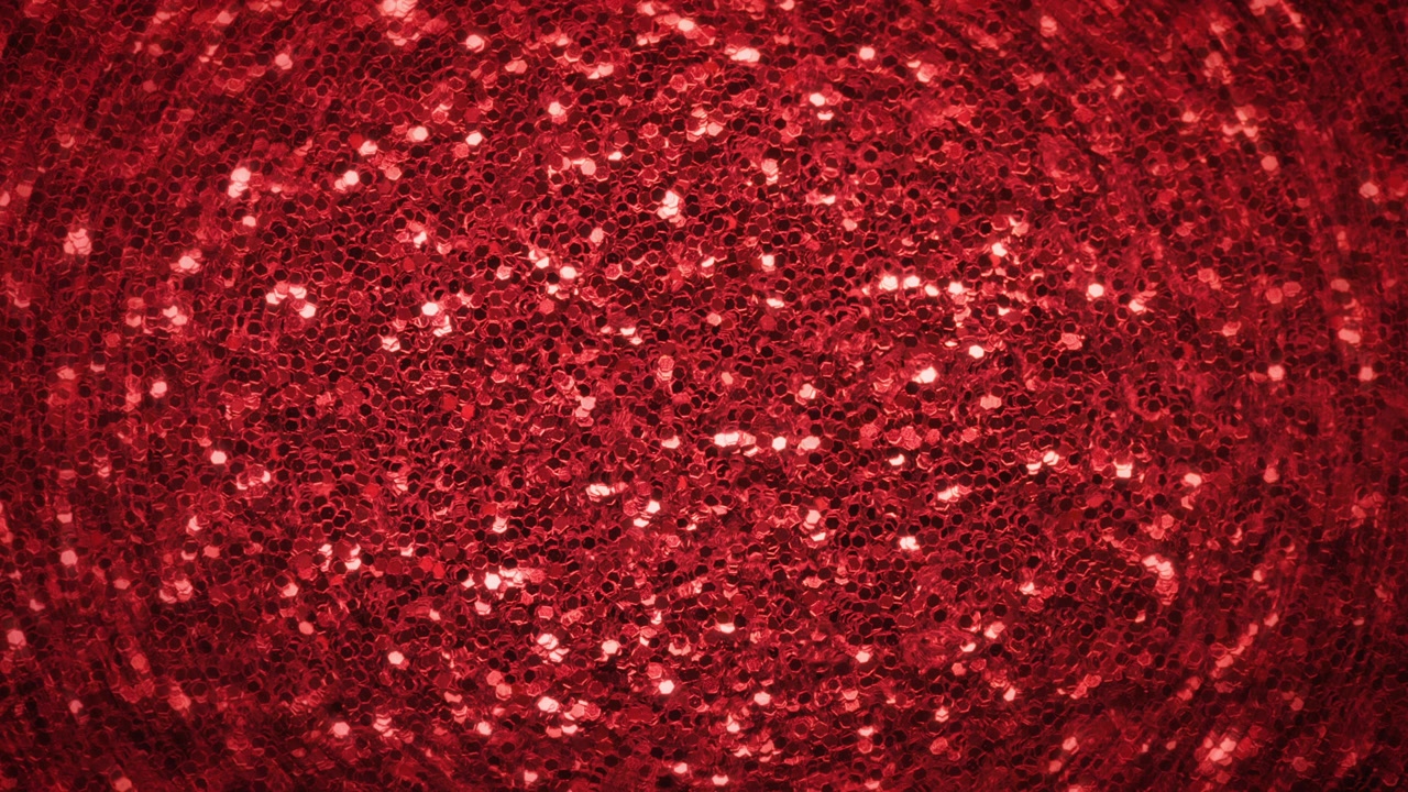 Abstract background of glowing red glitter