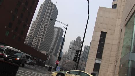 An-Angled-Shot-Of-Downtown-Buildings-With-Moving-Traffic