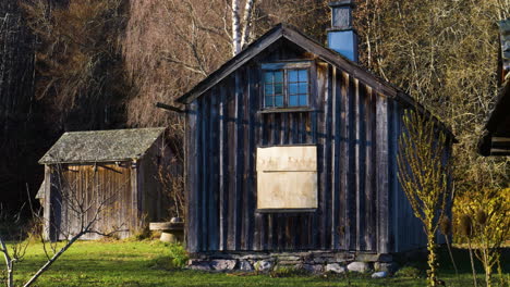 Slow-pan-shot-of-old-buildings-with-slate-roof-in-Dals-Rostock,-Dalsland,-Sweden