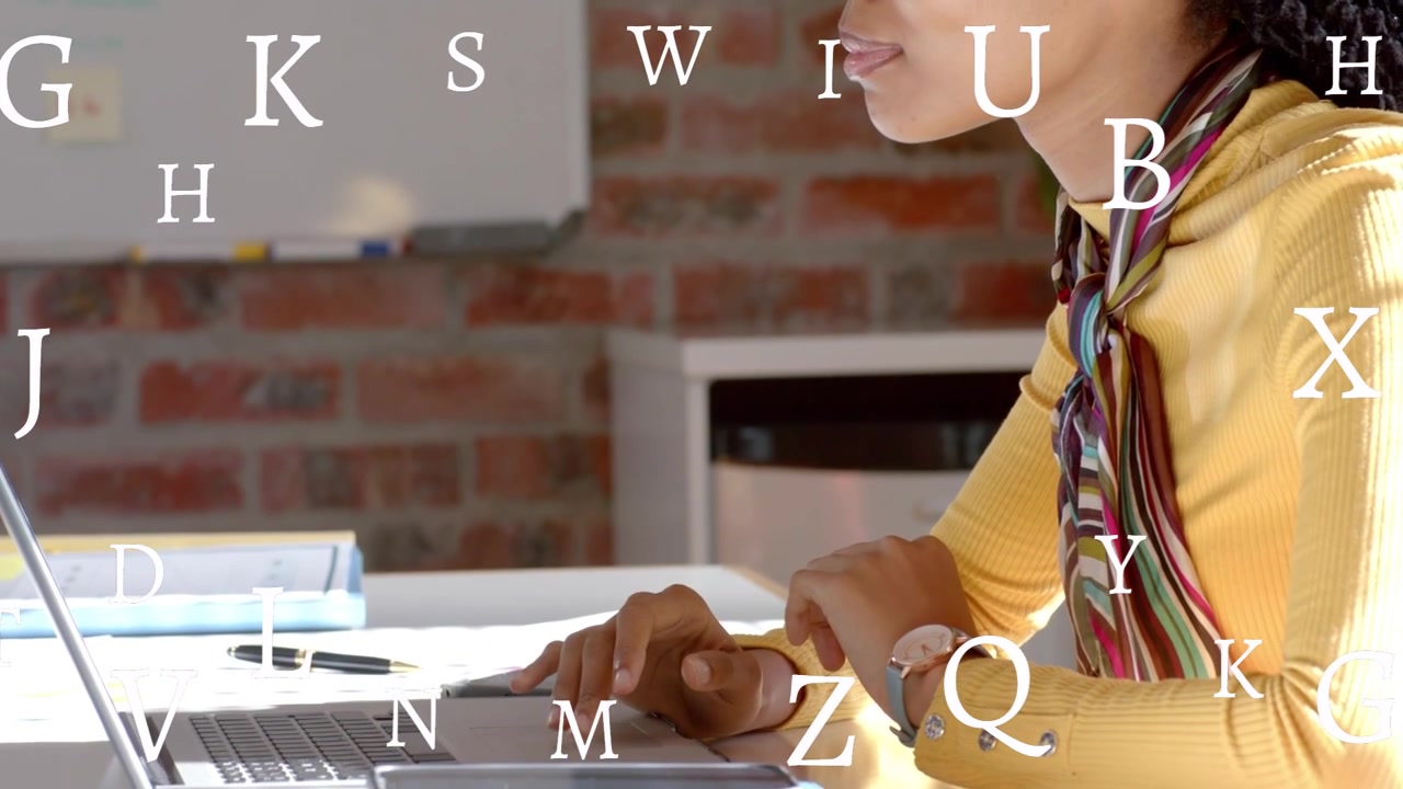 First keystroke starting floating letters around hands, woman typing at laptop studying education
