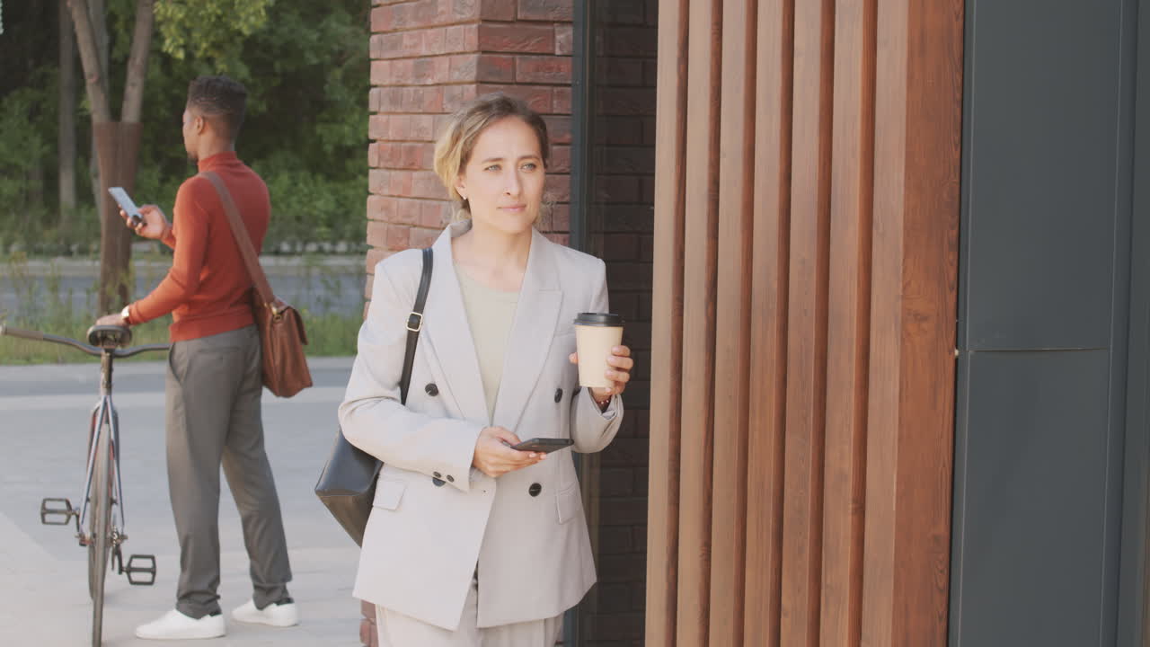 Businesswoman Walking in City Downtown