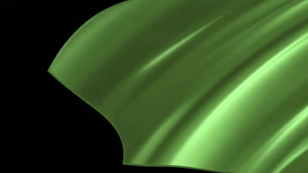 Green Silk Fabric Waving Against Black Background