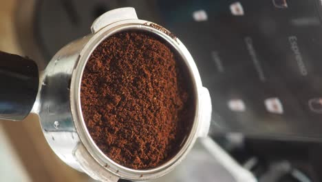 close-up of ground coffee in an espresso machine portafilter