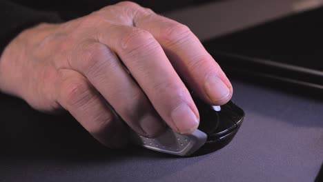 detail of a man using a computer mouse