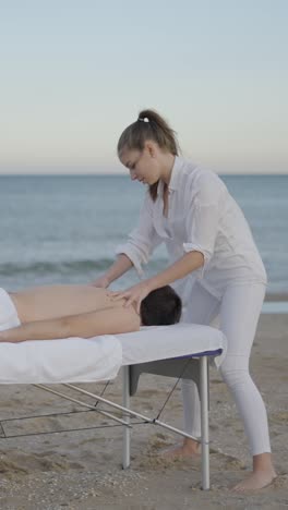 relaxing outdoor massage session on a beach