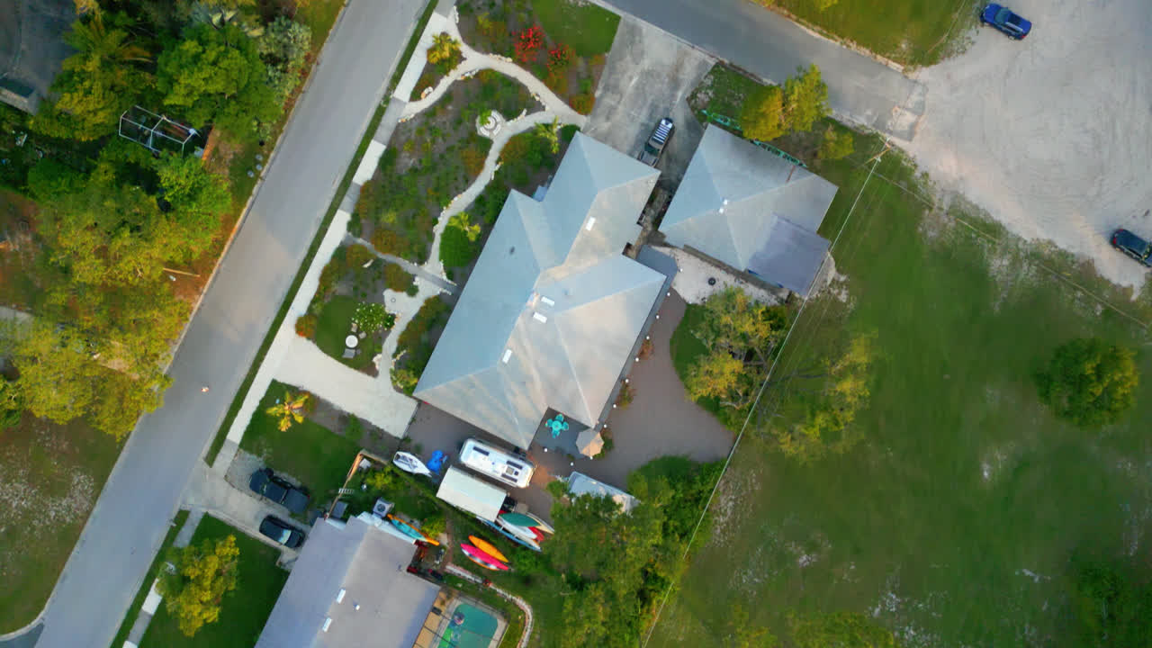 Aerial View Over An Organic Community Raised Bed Garden and Suburban Neighborhood In Tampa, Florida. Aerial Top Down Shot
