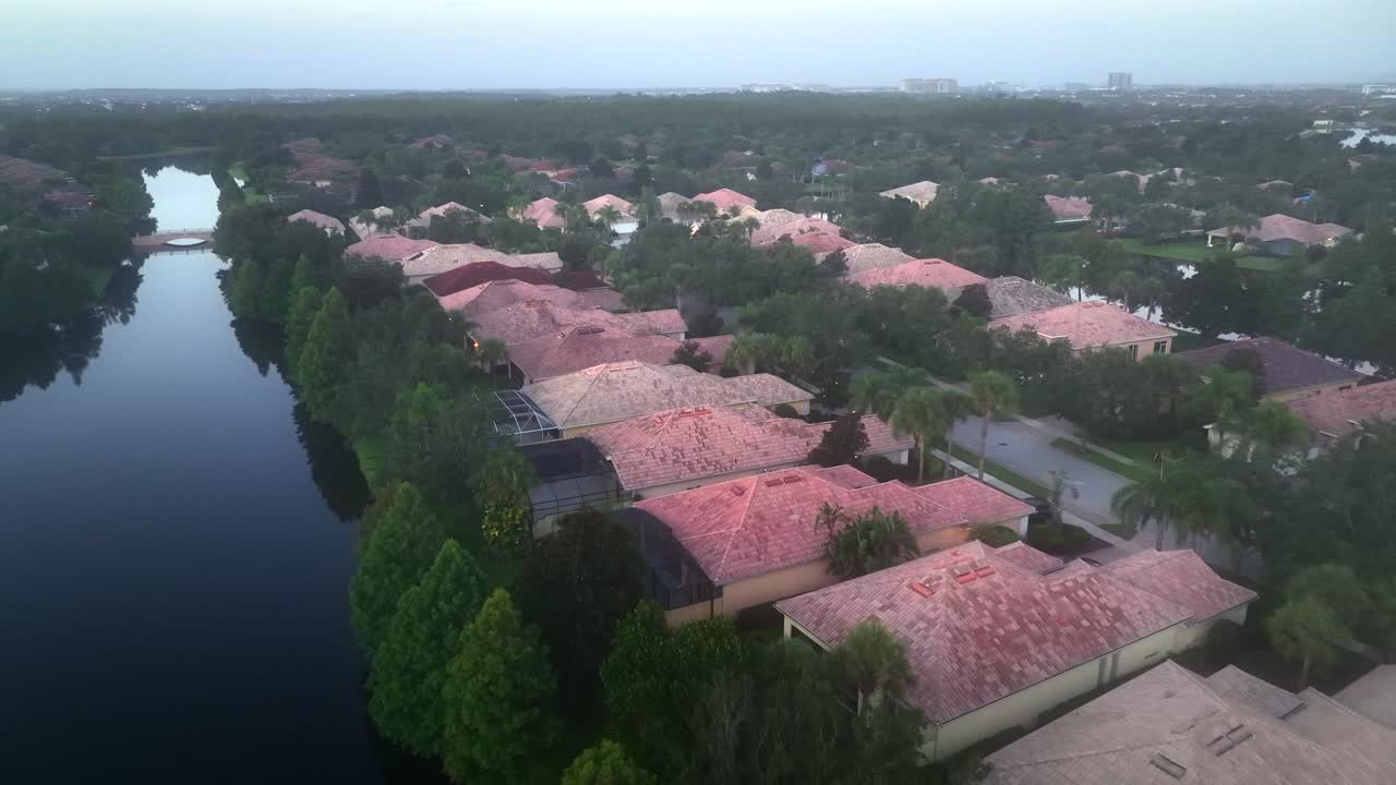 Luxury villas in Mediterranean style in Florida. Aerial flyover. Private river access in foggy morning. Aerial flyover