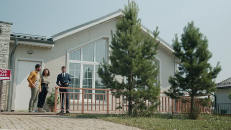 real estate agents showing a house to homebuyers