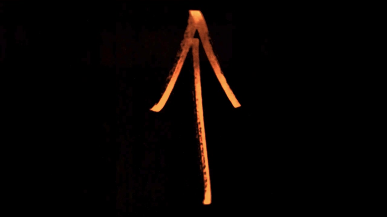 Abstract Hand-Drawn Symbols Appearing on Dark Background