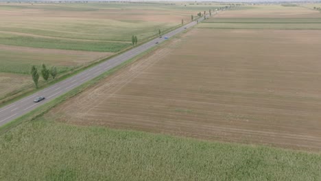 vehicles driving on european route 85 through fields in romania