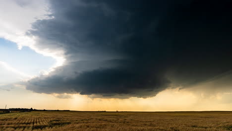 massive supercell thunderstorm over a wheat field