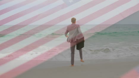 Animation-of-caucasian-businessman-by-sea-over-flag-of-usa