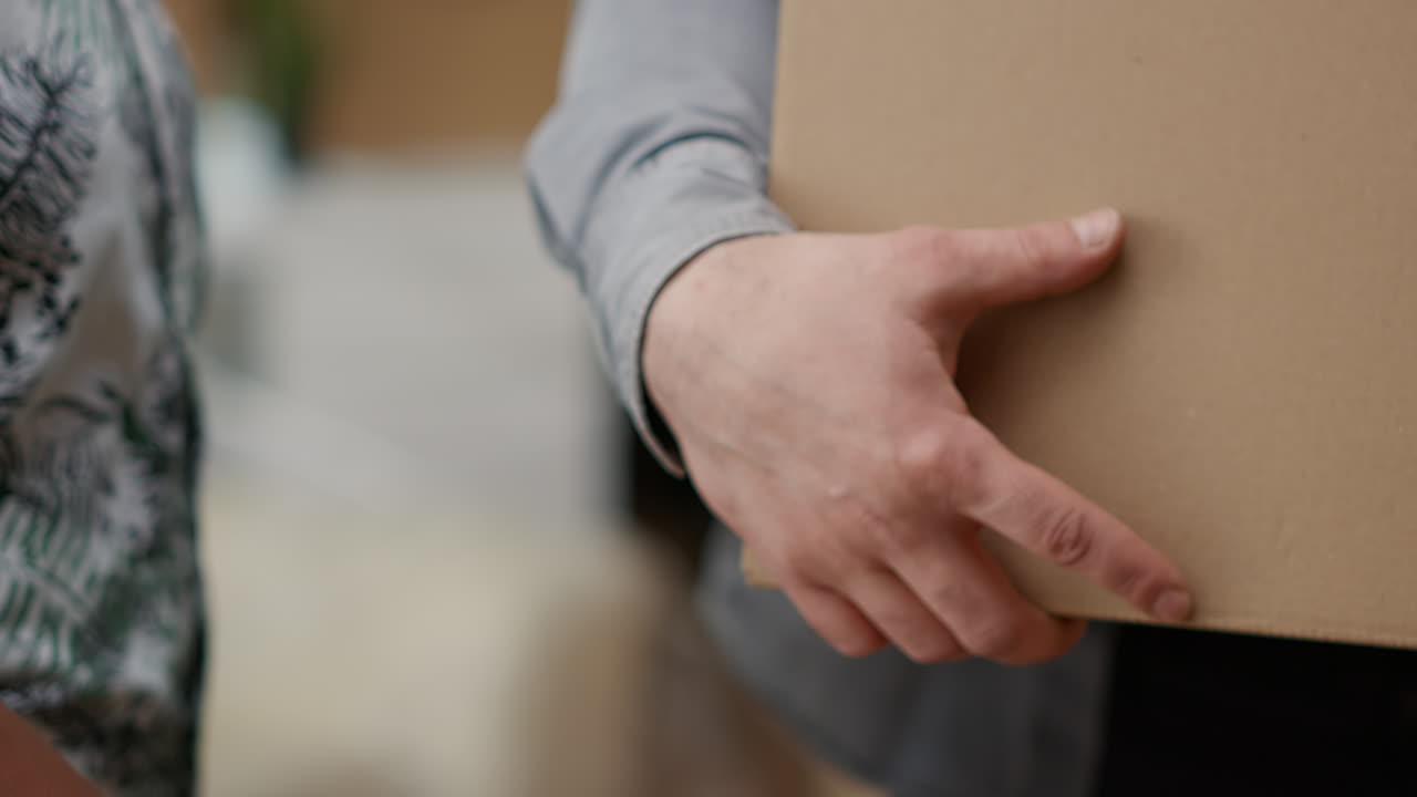 Life partners holding house keys of first real estate investment