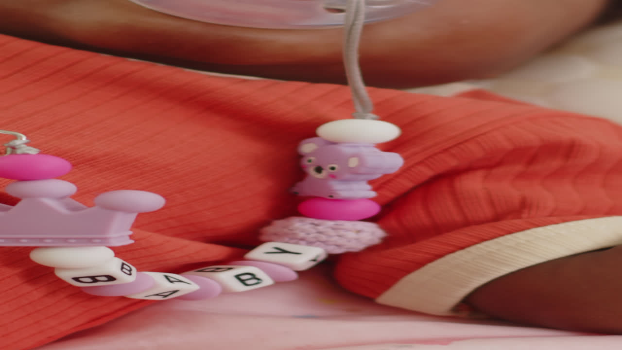 Vertical of Baby with Soother Taking Nap