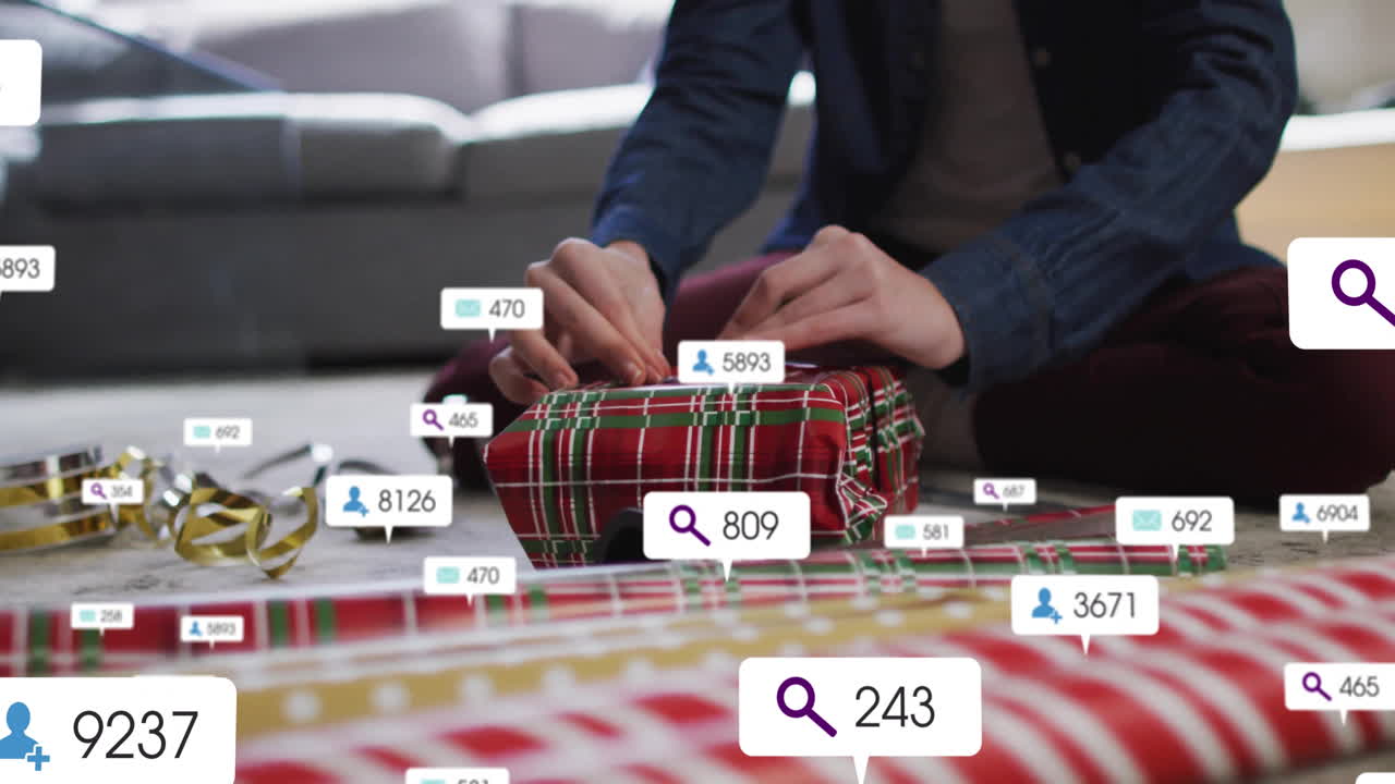 Woman wrapping gift with ribbon on living room floor, showing social media marketing overlay