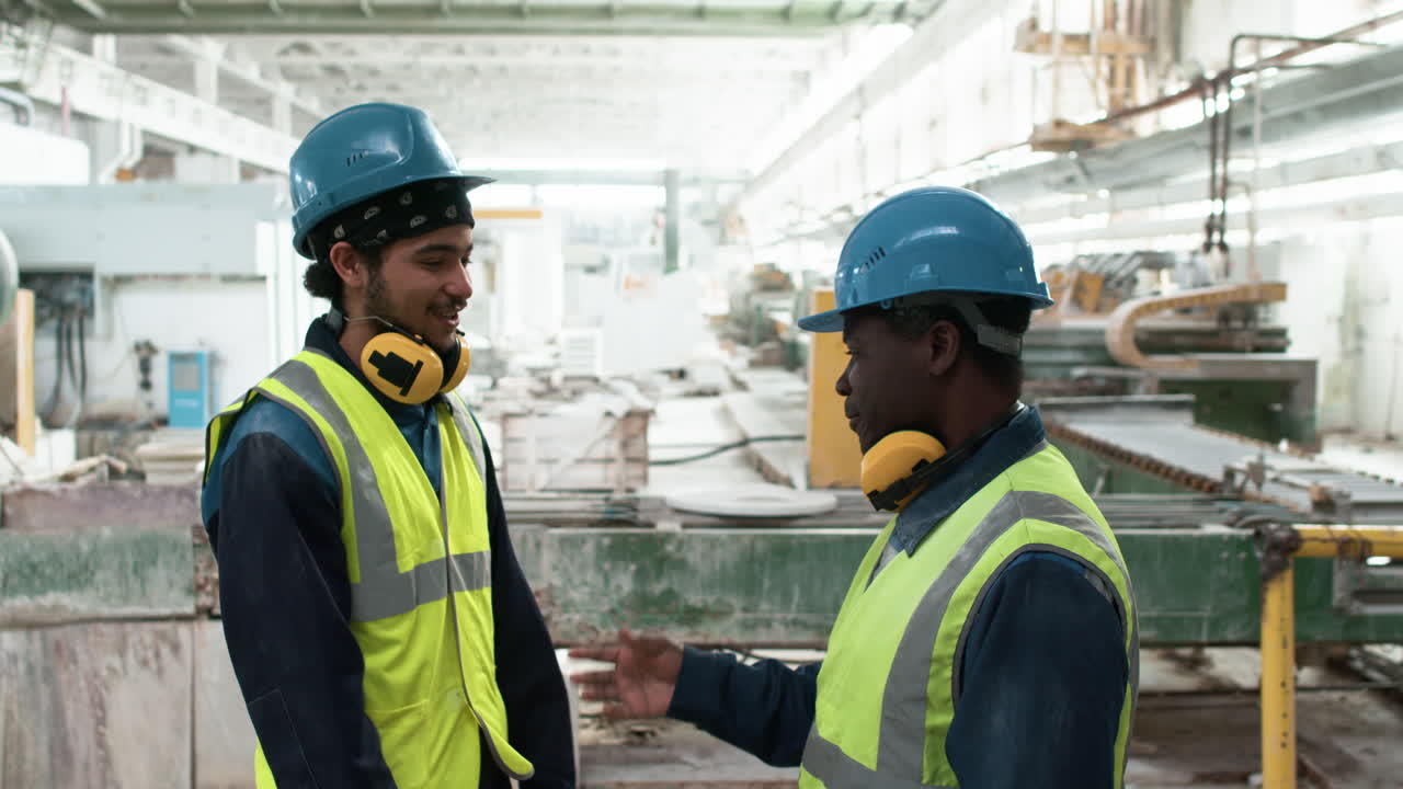 Workers talking at a marble factory