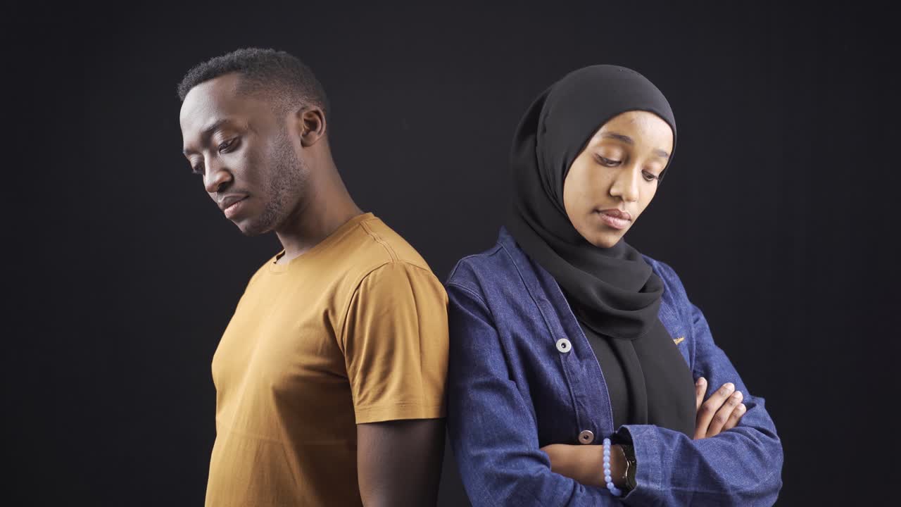 Portrait of stylish and attractive african muslim woman and man.