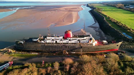 ghost ship the duke of lancaster at sunset - drone anti-clockwise rotate, bay backdrop - mostyn, north wales, uk