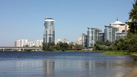 cityscape with river and modern buildings