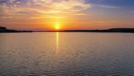 beautiful sunset is reflecting in the river. sunset lake landscape. colorful sky.