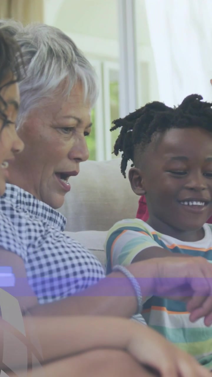 Vertical video: Senior woman tapping phone, teaching boy as mosaic sweeping, clearing closeup