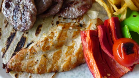 grilled chicken, steak, and fries plate