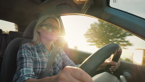 dreams journey by car woman driver in the rays of the setting sun driving a car