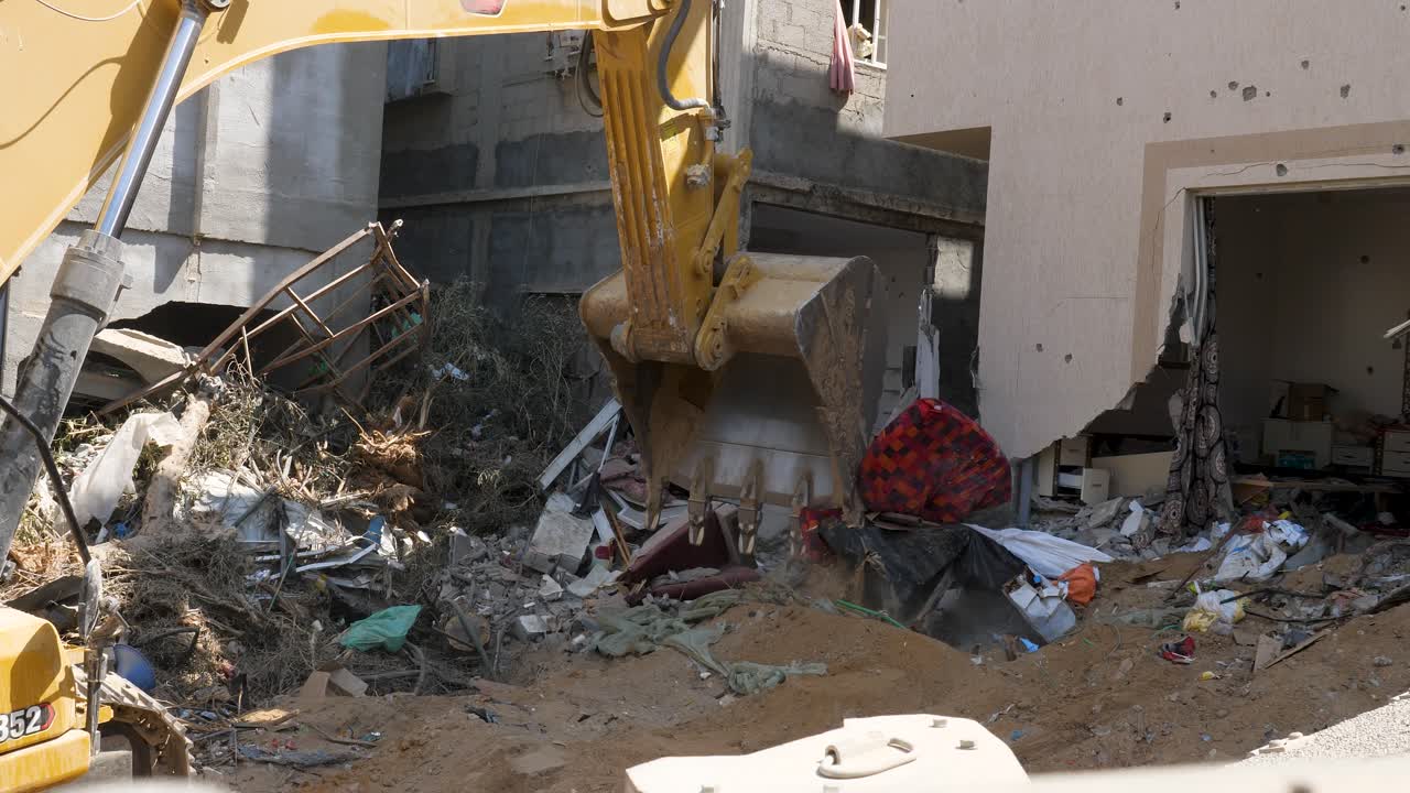 Bulldozers clear the rubble of collapsed buildings in the city of Rafah, Palestine due to chaos created by Israeli IDF troops