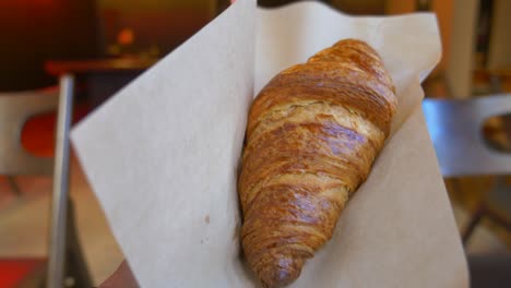 close-up of a golden, flaky croissant