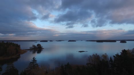 Drone-footage-of-the-archipelago-in-Helsinki,-Finland-during-blue-hour