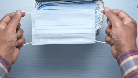 person opening a box of face masks