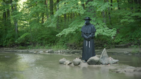 Plague-doctor-standing-in-stream