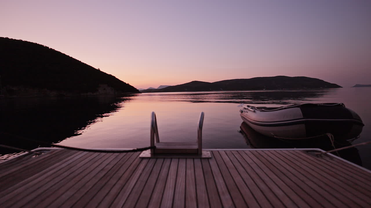 view from the swim deck of a yacht at sea in lefkada, greece at sunrise