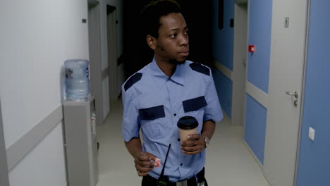 man in uniform relaxing on the corridor