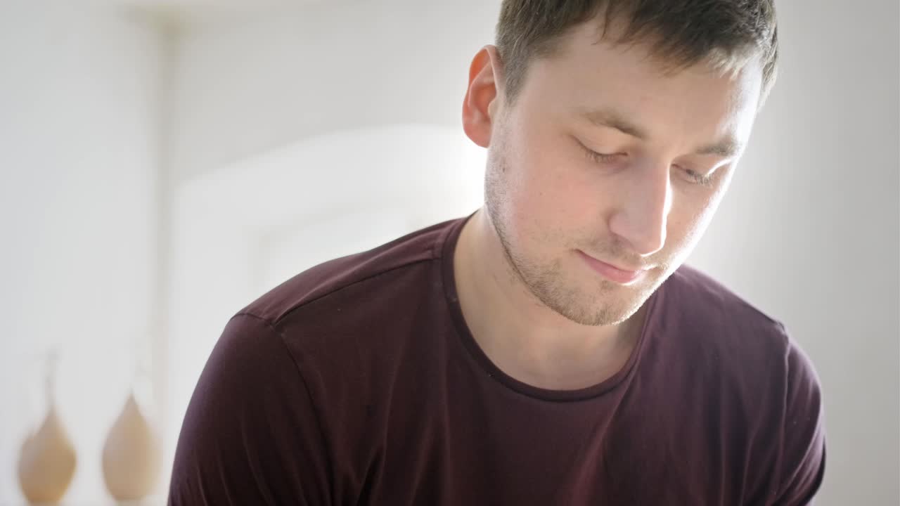 Close-up portrait of a man looking down