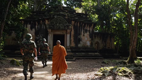 military and monk at ancient temple in the jungle