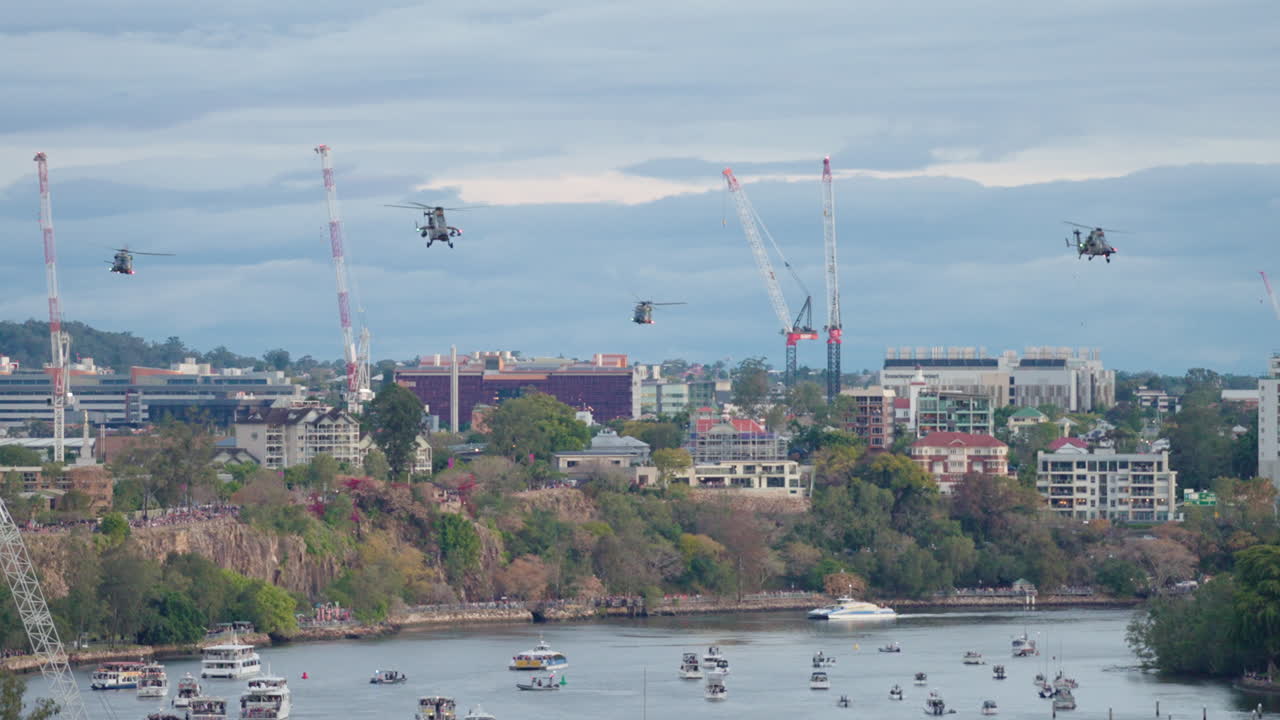 Army Helicopter Convoy Formation Flying Over Brisbane River During Riverfire Festival, 4K Slow Motion