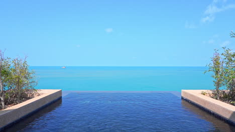 view of the ocean from the edge of a resort infinity pool