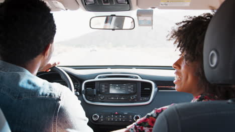 Happy-young-black-couple-driving-car,-back-view,-close-up