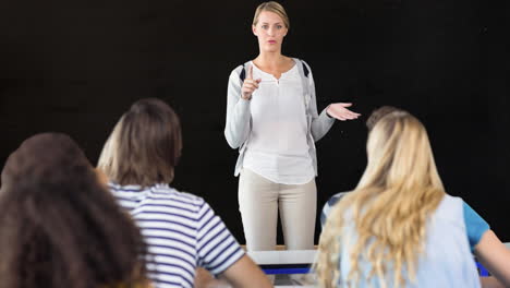 animation of caucasian female teacher and schoolchildren over board