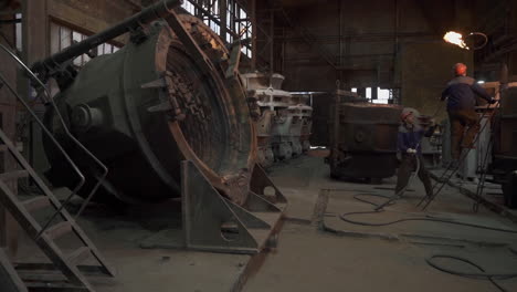 metal foundry workers in action