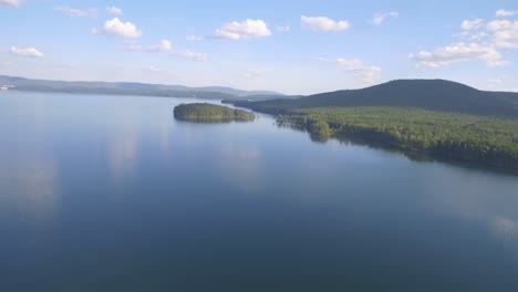 aerial view of a serene lake with islands and mountains