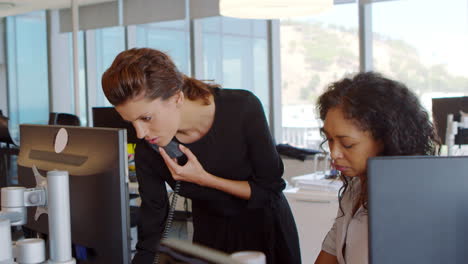 Businesswomen-Working-At-Office-Desk-On-Computer-Together