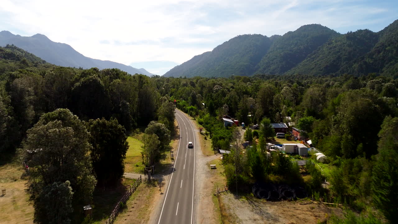 Vehicle Traveling Through Country Road In Chile, South America - Drone Shot