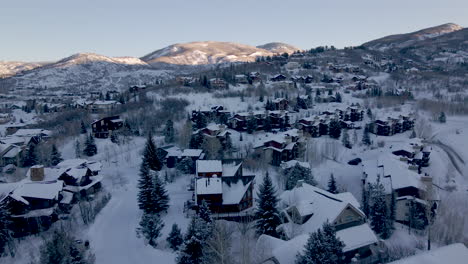 revealing drone shoot of the city of steamboat springs with breathtaking winter scenery, aerial view