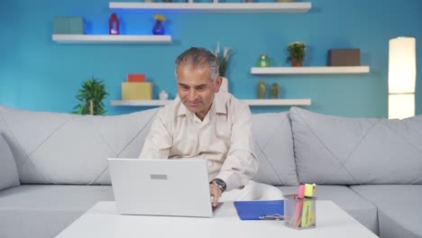 Home-office-worker-man-happy-and-smiling.